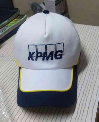 White and blue cap with KPMG emblem